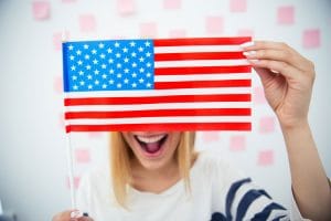 a woman holding the us flag